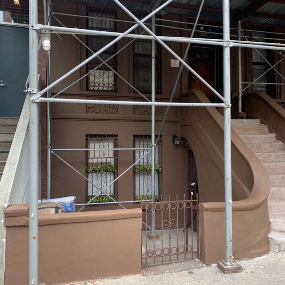 Brownstone facade restoration in Brooklyn after