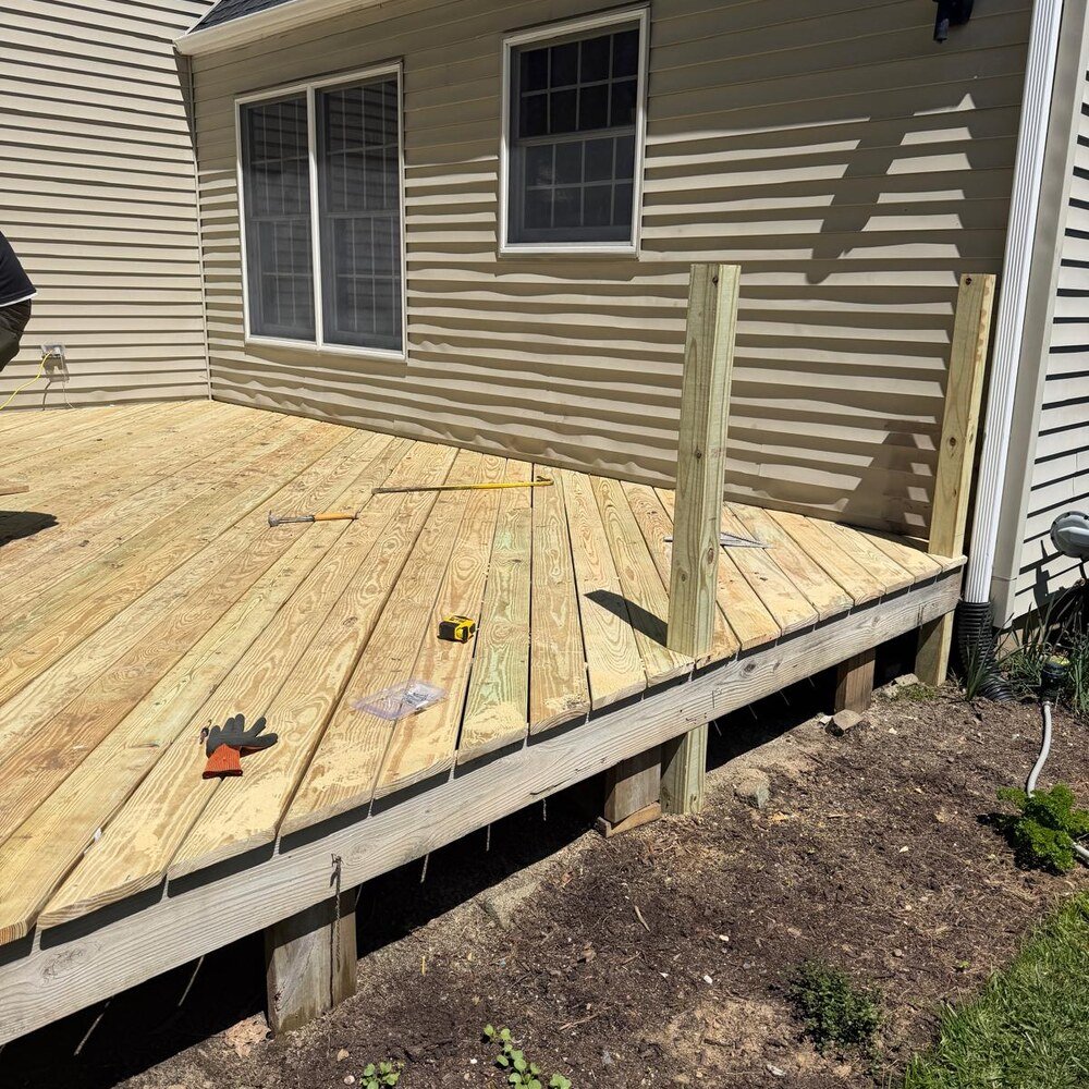 Backyard patio and retaining wall in Pelham Bay, Bronx, before