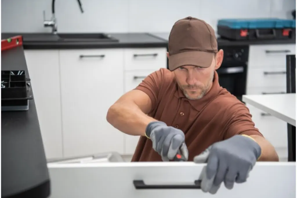 A kithchen remodeling professional is doing his job during kitchen remodeling project in Queens, NY. By Alliance Constructionny.