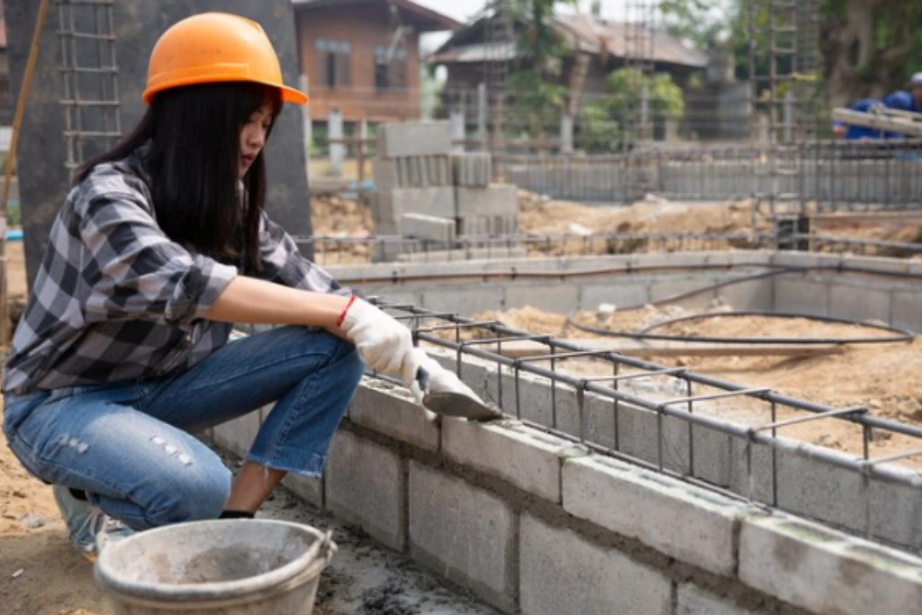 a masonry professional woring on a masonry project inthe queens